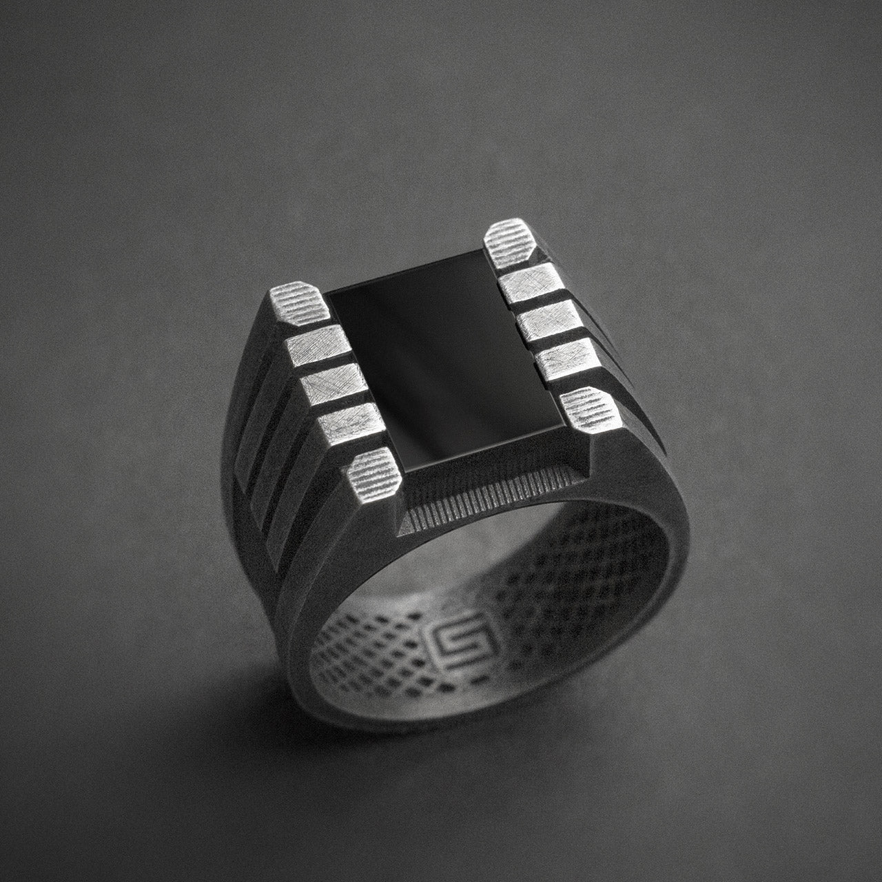 Black signet ring, dystopian vibe